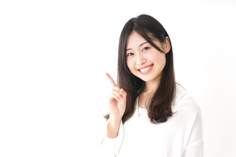 Young woman pointing something with smile